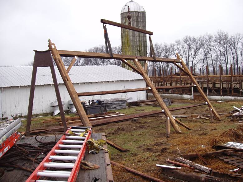 Camp Barn Frame Dismantle / A bent being laid down